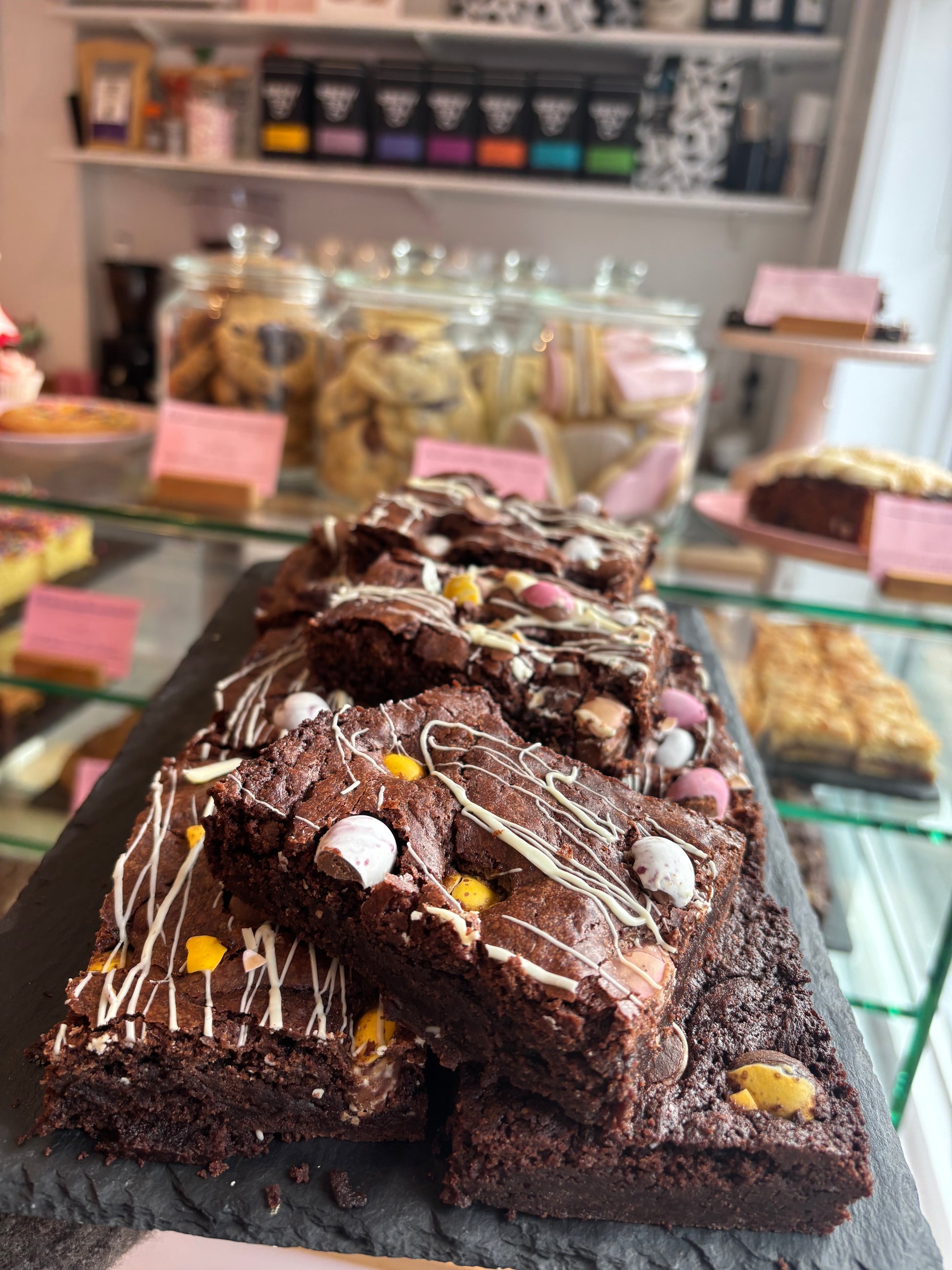 Fudgy Mini Egg brownies with white chocolate drizzle, box of four slices