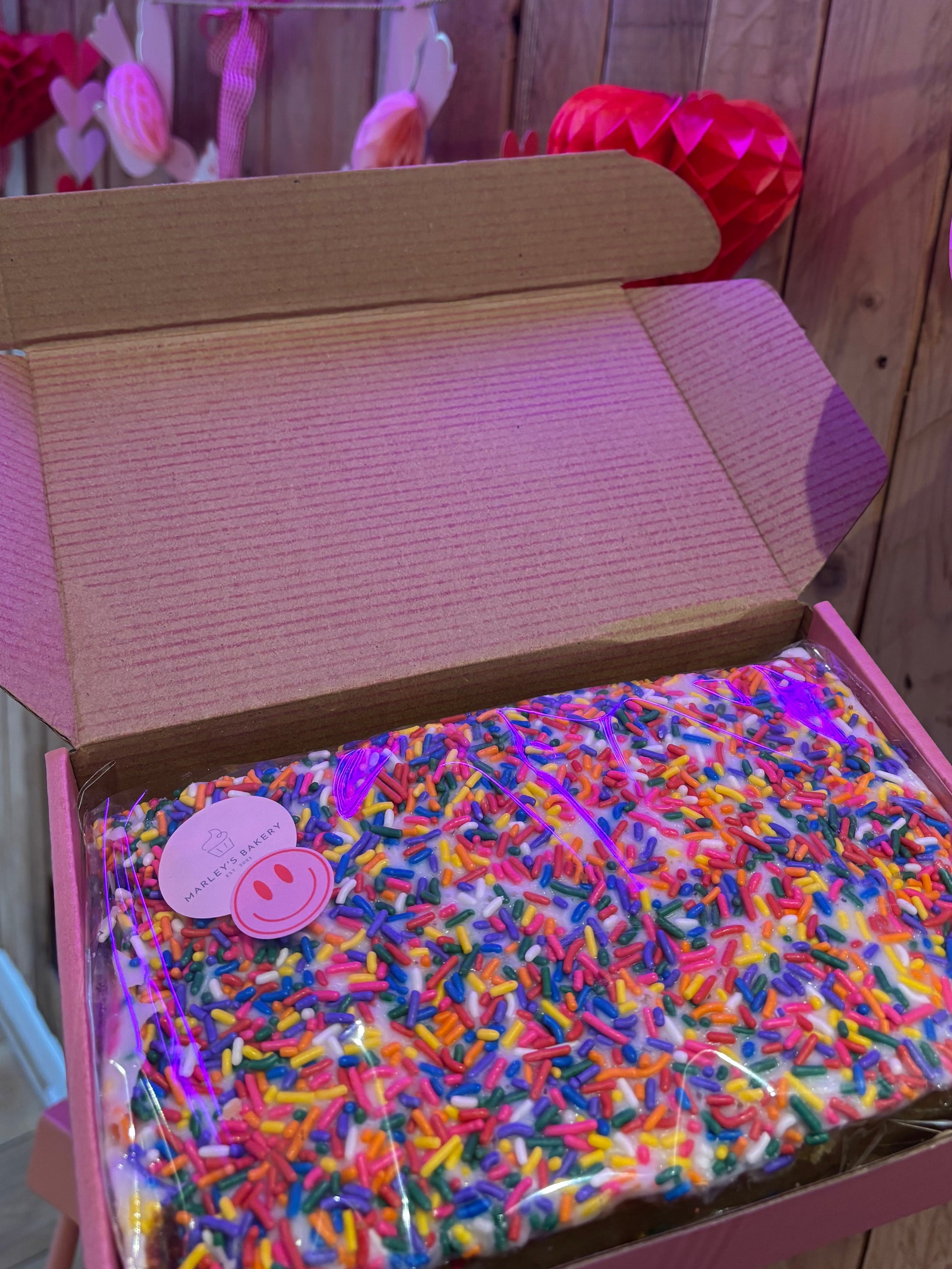Old School Cake with thick icing and rainbow sprinkles, box of six slices